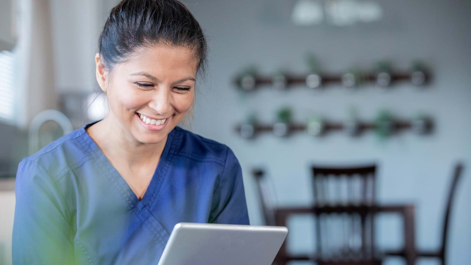 Healthcare Nurse holding patient's hand