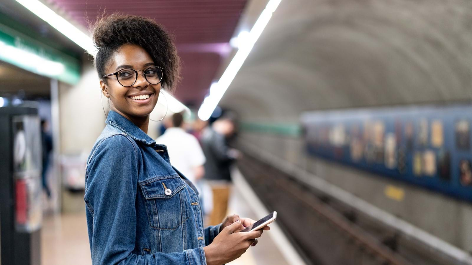 Woman on her company mobile intranet whilst in the subway 